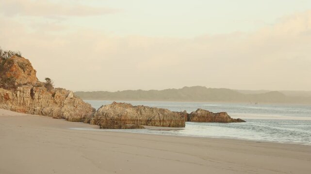 sunset light and dusk falling upon Grotto Lagoon and rock formations, Hermanus, South Africa