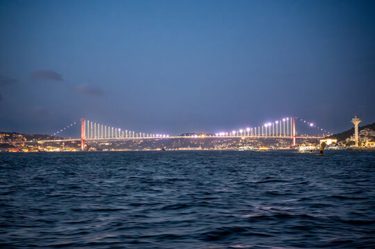Istanbul,turkey,august 4, 2025. Istanbul bosphorus bridge glowing with lights at night, connecting continents over the bosphorus strait with city skyline