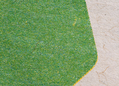 Green Halftone Shape on Fibrous Paper