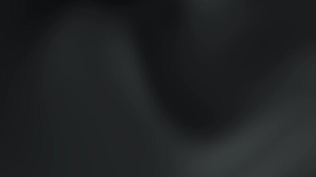Soft smooth fabric in dark grey tones with an abstract, elegant flow perfect for backgrounds, textures, or minimalist designs.