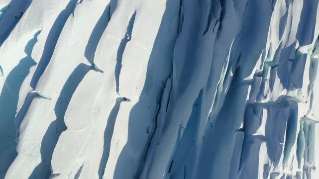 Abstract Texture of Sunlit Glacier Ice Fissures and Deep Blue Shadows