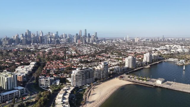 Port Melbourne and in Albert Park, Victoria, Australia &ndash; 4K aerial drone view of sandy coastline, Port Phillip Bay, residential suburbs, beaches, piers and spectacular Melbourne CBD skyline