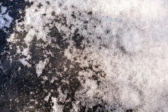  winter macro texture. Top View of Snow on Ice Formation with Bubbles Macro Detail of Snow on on Ice Formation with Bubbles Melting Snow on Ice texture in cold water.Cold weather and frosts 