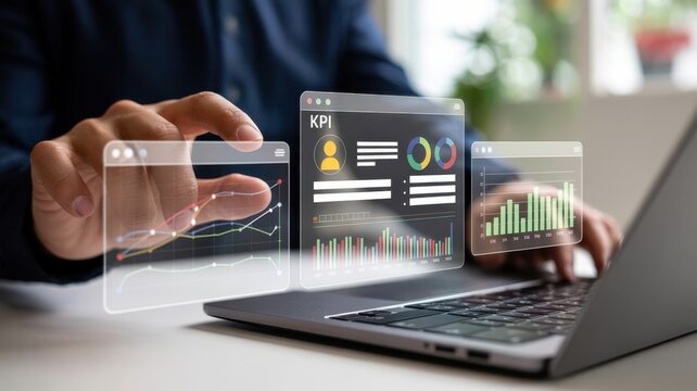 Business working on laptop with interactive holographic data charts and kpi dashboard for corporate performance monitoring and strategic decision making