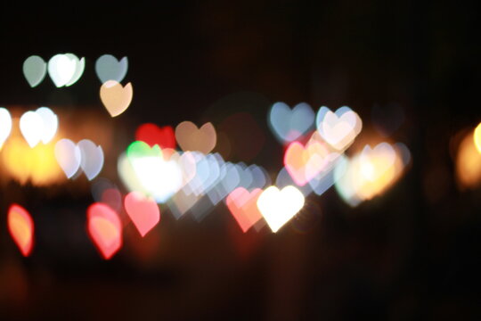 Heart Shaped Bokeh Lights at Night Abstract Background