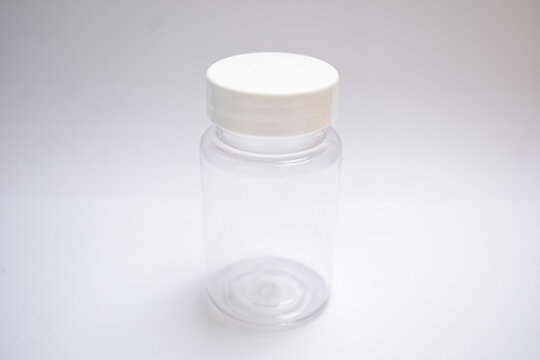 Empty clear plastic medicine jar bottle mock up isolated on plain white background