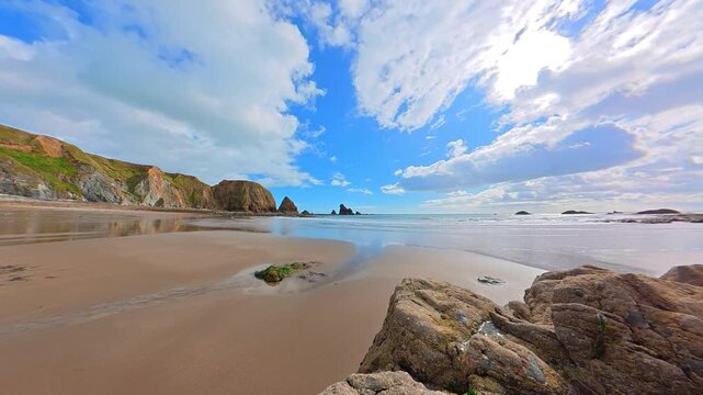 Beautiful nature Ireland Timelapse Copper Coast Waterford Ireland ebbing tide on golden sands timeless peace