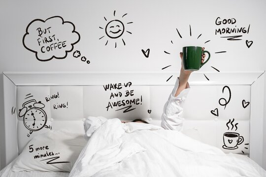 A woman lies under white bedding and raises an arm holding a green mug, surrounded by hand drawn doodles of a sun, alarm clock, and motivational morning lettering, a concept of morning motivation.