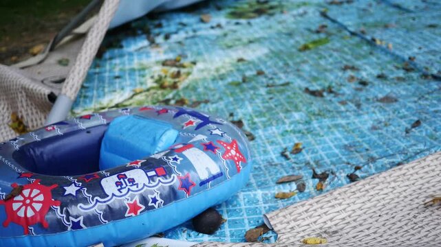 Deflated or Broken Pool Series - Close up of Mossy Pool Liner 