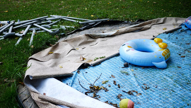 Deflated or Broken Pool Series - Deflated Pool in Side Yard of Home