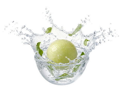 Green apple falling into clear water isolated on transparent background