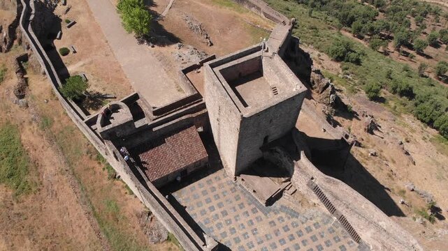 **Aerial drone crane-up movement toward a near-vertical view of Marv&atilde;o Castle&rsquo;s main tower in Portugal.**