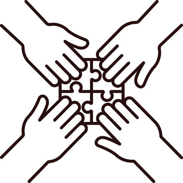 Four hands holding puzzle pieces together as a symbol of teamwork and unity