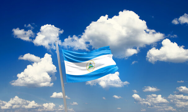 Nicaragua national flag waving with skyline and buildings. Nicaragua national flag for independence day.