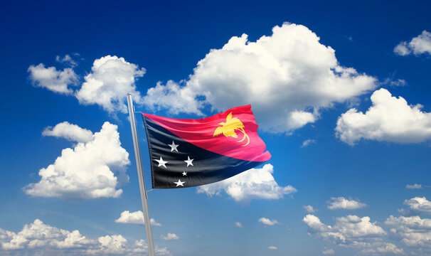 Papua New Guinea national flag waving with skyline and buildings. Papua New Guinea national flag for independence day.