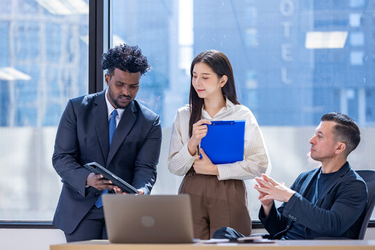 Team of diversity business people are discussing over the new strategic strategy project over investment real estate while working in modern office building for new project and planning