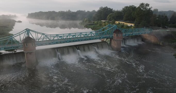 Bartoszowice weir and truss bridge in misty Wrocław morning