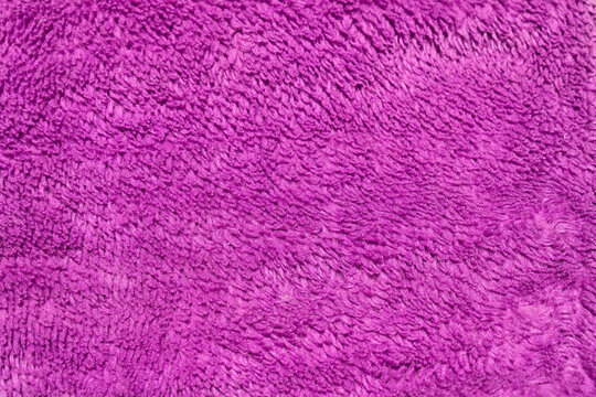 Pink blanket texture with shadows. Fluffy carpet background. Blank textile. Warm natural material. Soft fabric backdrop detail. flat surface. Home canvas design. side view, close up, front. background