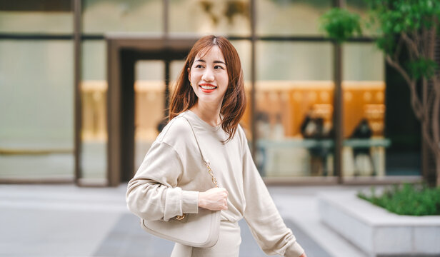  Single adult asian business woman happy walking with beautiful smile
