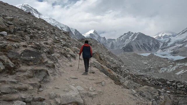 Rear view of tourist while walking close to Everest Base Camp in Nepal. Everest Base Camp Trek is undoubtedly the adventure of a lifetime and one of Nepal's best trekking destination.