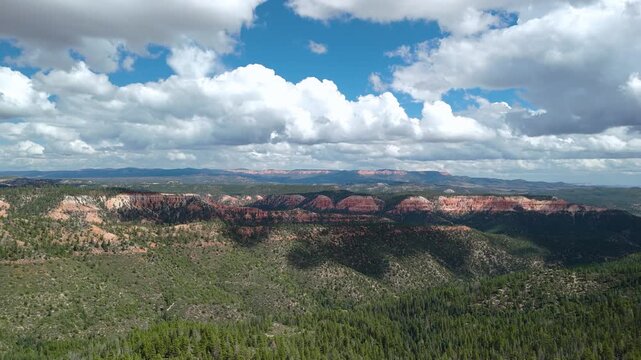 Drone Flyover of Red Rock Mountain Cliffs and Pine Trees in Utah
