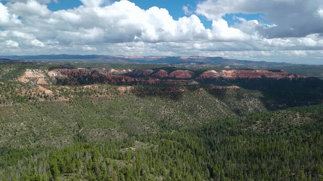 Drone Flyover of Red Rock Mountain Cliffs and Pine Trees in Utah
