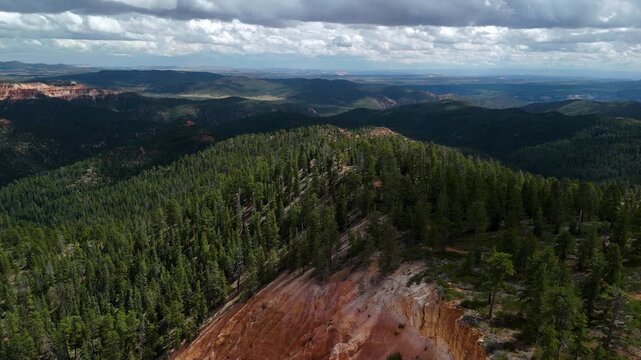 Drone Flyover of Red Rock Mountain Cliffs and Pine Trees in Utah