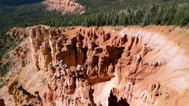 Aerial View of Red Rock Canyon Cliffs and Pine Forest in Utah