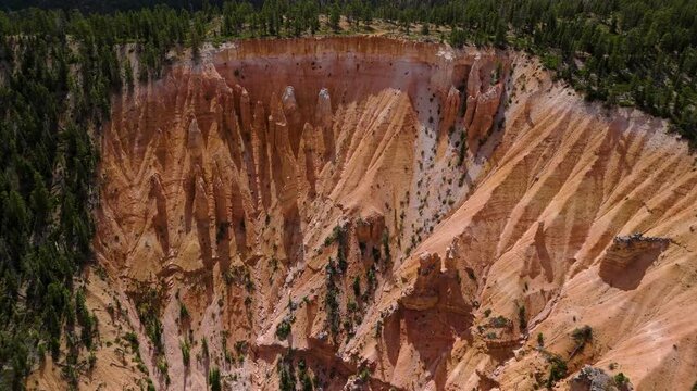 Aerial View of Red Rock Canyon Cliffs and Pine Forest in Utah