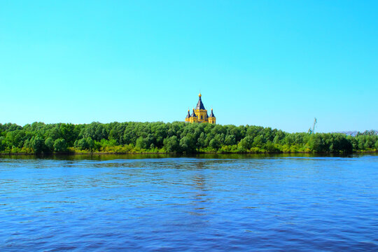 NIZHNY NOVGOROD, RUSSIA - MAY 22, 2026: View from a boat at Oka river. Grebnevskie Sands Island, a large island situated before its confluence with the Volga River, and Alexander Nevsky Cathedral