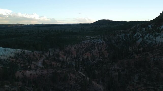 Drone Flyover of Red Rock Mountain Cliffs and Pine Trees in Utah
