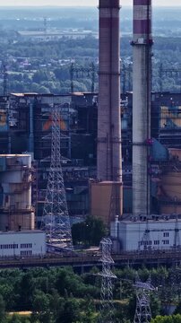 Towering Smokestacks At ZE PAK S.A. Elektrownia Pątn&oacute;w Power Station In Pątn&oacute;w Near Konin, Greater Poland, Poland. Vertical, Aerial Shot