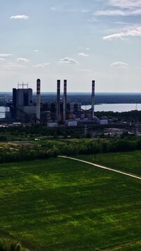 Industrial Chimney At ZE PAK S.A. Elektrownia Pątn&oacute;w In Pątn&oacute;w Near Konin, Greater Poland, Poland. Vertical, Aerial Shot