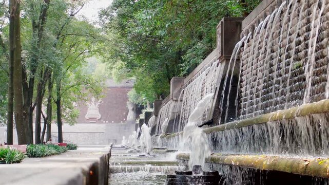 Spectacular fountain aztec style Chapultepec park Mexico City clean water running prehispanic symbolism bird flying around