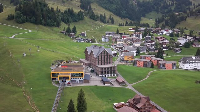 Parallax aerial view of Stoos funicular station and Swiss alpine village