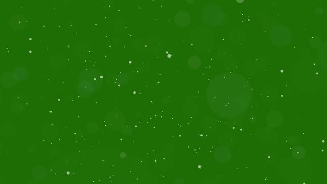 white glitter dust particles and soft bokeh floating on green screen background, sparkling magic dust overlay animation for chroma key compositing, 4K festive and fantasy video effect