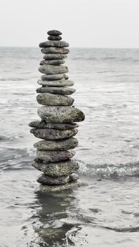 Balanced Stone Stack by the Sea on Saint Martin&rsquo;s Island. stack of stones on beach