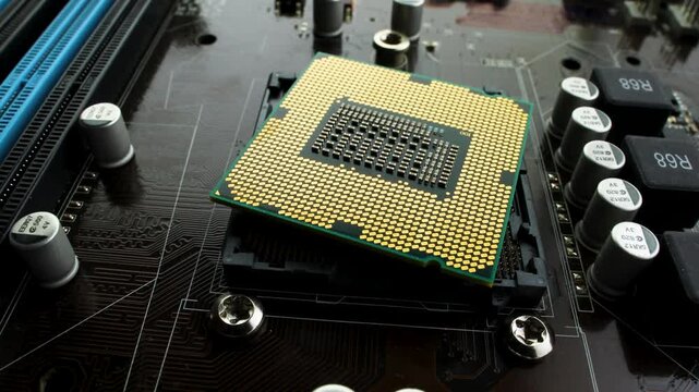 Computer processor or central processing unit CPU on motherboard, technology concept close up footage.