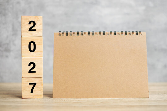 2027 Happy New Year with blank notebook and wooden number. countdown, Resolution, Goals, Plan, Action and Mission Concept