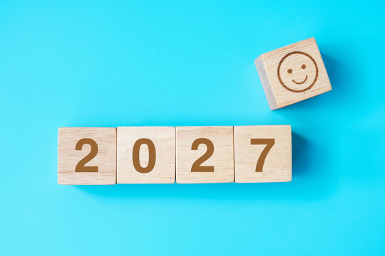 Smile face block with 2027 text on blue background. Satisfaction, feedback, Review and New Year concepts