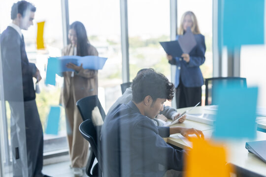 business professional team holding corporate meeting in modern office space promoting collaboration and engaged teamwork