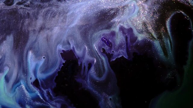 Swirls of inky color drift and fold while a dense field of bright pigment specks glimmers over the frame, ideal as a dreamy VJ or title background.