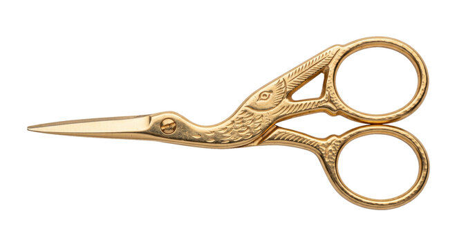 Elegant golden stork scissors with intricate bird-shaped handles are captured in a studio shot against a clean white background