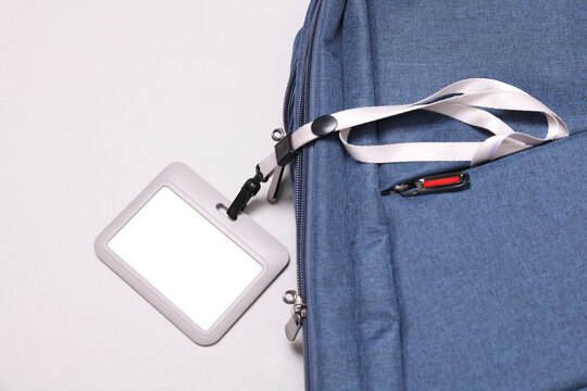 backpack for laptop and id badge on white background