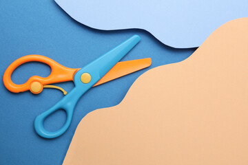 Paper cut, wavy background of colored layers with scissors. Children's creativity © splitov27