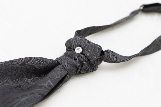 Black paisley cravat with sparkling tie pin