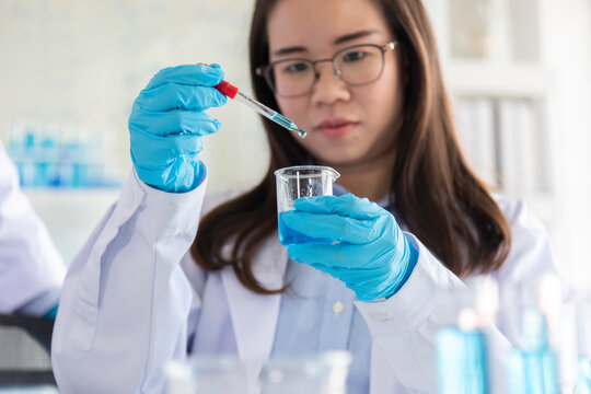 Scientist Professional researcher performs chemical analysis in bright, sterile environment