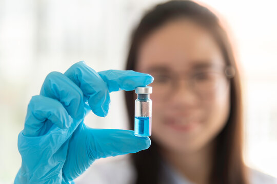 Scientist Professional researcher performs chemical analysis in bright, sterile environment