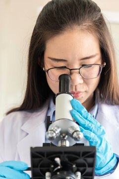 Scientist Professional researcher performs chemical analysis in bright, sterile environment