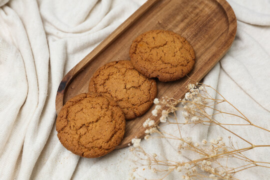 Oatmeal cookies in a tray on fabric background